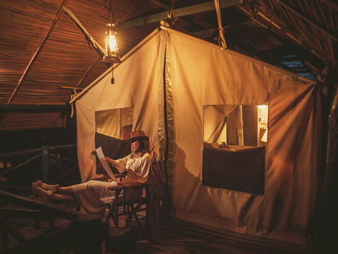 Beautiful woman in a tent at savanna, Kenya