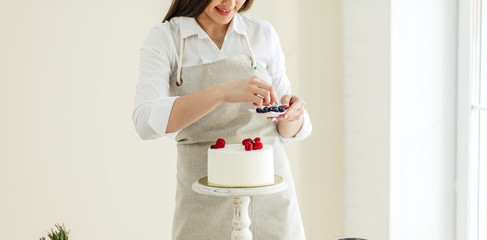 cakefor lovers of sweet. sweet pleasure, woman preparing cake for a friendly party, close up cropped photo