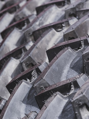 Detailed closeup of rubber tire wheel surface.