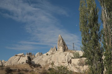 View of ancient Nevsehir cave town and a castle of Uchisar dug from a mountains in Cappadocia, Central Anatolia,Turkey