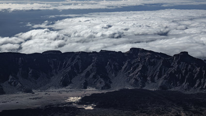 Fototapeta na wymiar Aerial view of mountain range as a barrier for the clouds