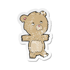 retro distressed sticker of a cartoon cute teddy bear