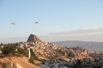 View of ancient Nevsehir cave town and a castle of Uchisar dug from a mountains in Cappadocia, Central Anatolia,Turkey