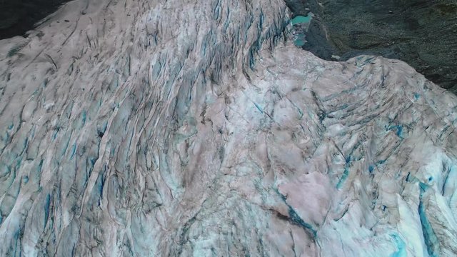 A beautiful aerial reveal of the mouth of an Alaskan glacier.