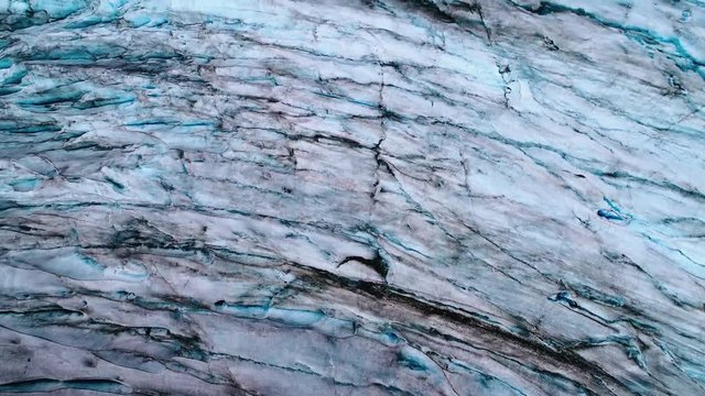 Inception style aerial from above of an Alaskan glacier from above.