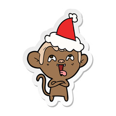 crazy sticker cartoon of a monkey wearing santa hat