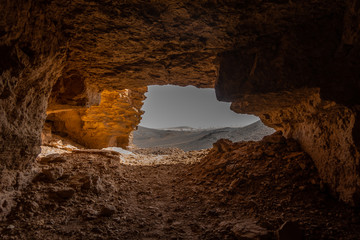 View from a cave entrance in the rocky desert of Sudan, Africa