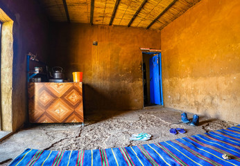Inside a rest stop in the desert of Sudan with a blue carpet and a stove where food, tea and coffee are prepared, Africa