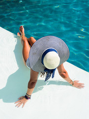 Woman sitting in the swimming pool