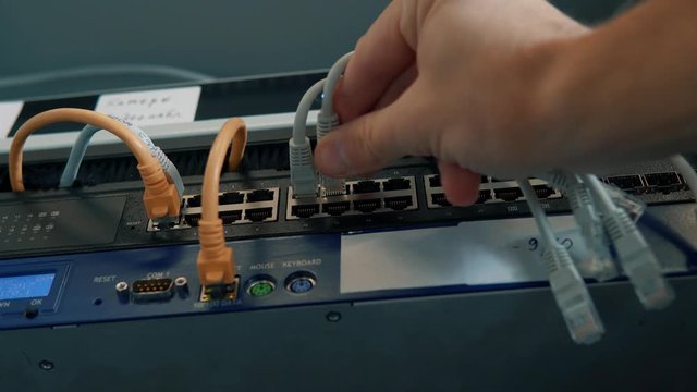  Server IT Engineer In Data Center Server Room.Engineer Working Laptop Computer.Server Room Works.Programmer Checks A work Of Server At A Data Center. 