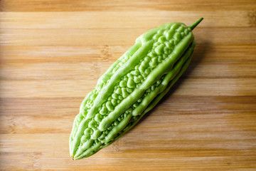Bitter melon on wooden background