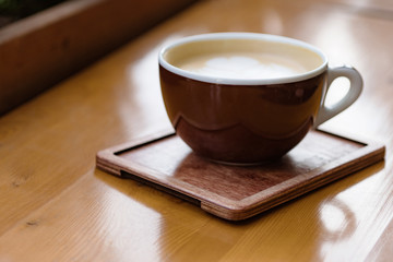 cup of coffee cappuccino cappucino on wooden table