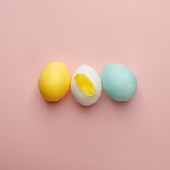 Happy Easter concept. Flat lay. Minimal concept. Top view. Set of colorful Eggs on pink background, modern easter