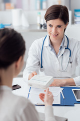 Doctor giving a prescription medicine
