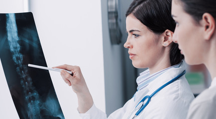 Doctor examining patient's x-ray