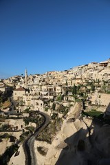 View of ancient Nevsehir cave town and a castle of Uchisar dug from a mountains in Cappadocia, Central Anatolia,Turkey