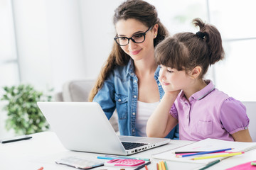 Woman and child using a laptop together