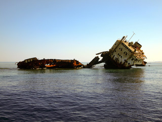 Shipwreck, wreckage of a cargo ship. The rusty wreck on Jackson reef, Tiran island, Red sea, Egypt.