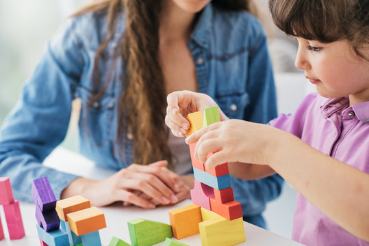 Teacher And Child Playing Together