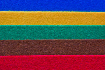 Pieces of coloured felt. Brown, red, turquoise, yellow and  blue color composition. Colorful felt...