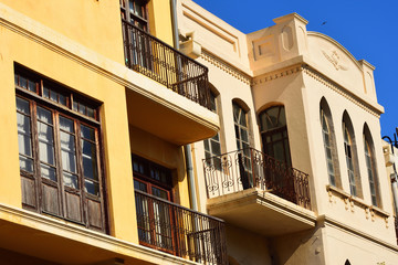 Facade of a house in Tel Aviv with typical architectural style. 