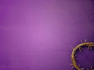 Good Friday, Lent Season and Holy Week concept - A woven crown of thorns on purple background.