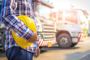 Truck driver safety hat holder,Performing a pre-trip inspection on a truck,Truck driver start trip,spot focus,copy-space