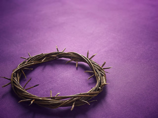 Good Friday, Lent Season and Holy Week concept - A woven crown of thorns on purple background.