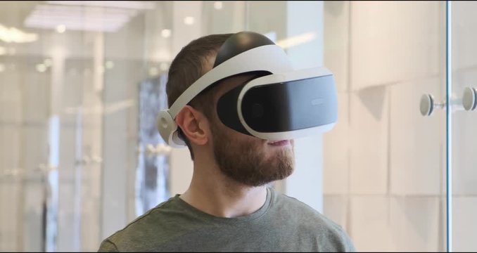 Man using virtual reality headset indoors 4k