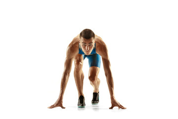 Fototapeta premium Young caucasian man preparing to run isolated on white studio background. One male runner or jogger. Silhouette of jogging athlete with shadows.