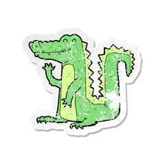 retro distressed sticker of a cartoon crocodile