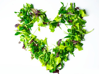 Plakat Mixed salad leaf. Lettuce spinach isolated on white background, heart shape from greenery