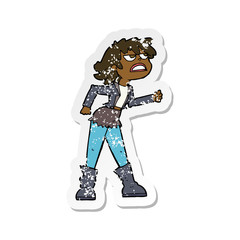retro distressed sticker of a cartoon angry biker girl
