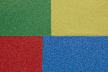 Pieces of coloured felt. Red, yellow, green and  blue color composition. Colorful felt texture for background with copy space.