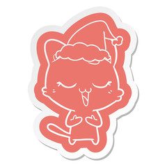 happy cartoon  sticker of a cat wearing santa hat