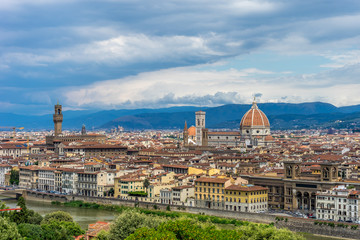 Fototapeta na wymiar Panaromic view of Florence townscape cityscape viewed from Piazzale Michelangelo (Michelangelo Square) with ponte Vecchio and Palazzo Vecchio with lightningPanaromic view of Florence townscape citysca