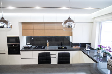 Dark brown modern kitchen interior in luxury home