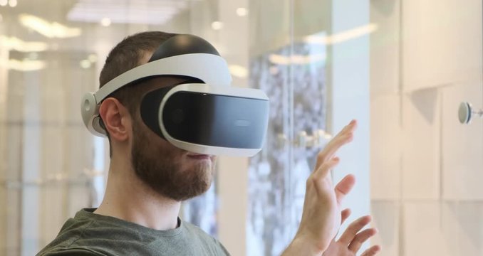 Man using virtual reality headset indoors 4k, typing