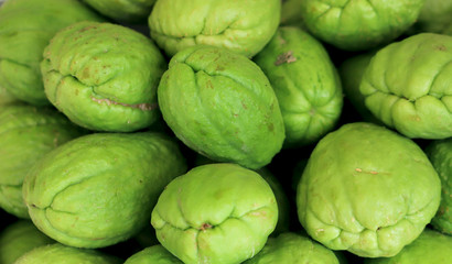 Exotic interesting green fruit. Cropped shot, horizontal, close-up, side view, nobody. Concept of agriculture and healthy eating.