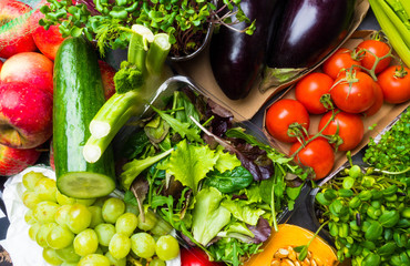 Arrangement of different colorful tasty vegetables fruits background. Horizontal. Healthy Food Concept.