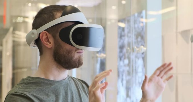 Man using virtual reality headset indoors 4k, typing
