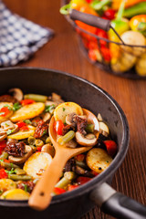 Fried pan vegetables, with mushrooms and dried tomatoes. Seasoned with a mix of herbs.