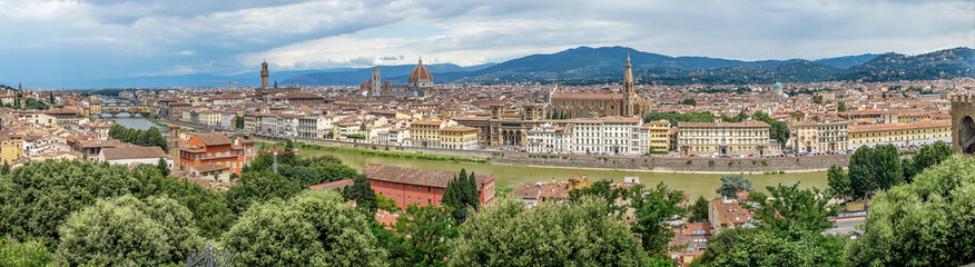 Fototapeta premium Panaromic view of Florence with Basilica Santa Croce and City gate of San Niccolo and Duomo and Ponte Vecchio viewed from Piazzale Michelangelo (Michelangelo Square)