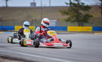 Young go cart racer on circuit