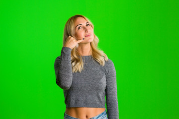 picture of lovely woman making a call me gesture