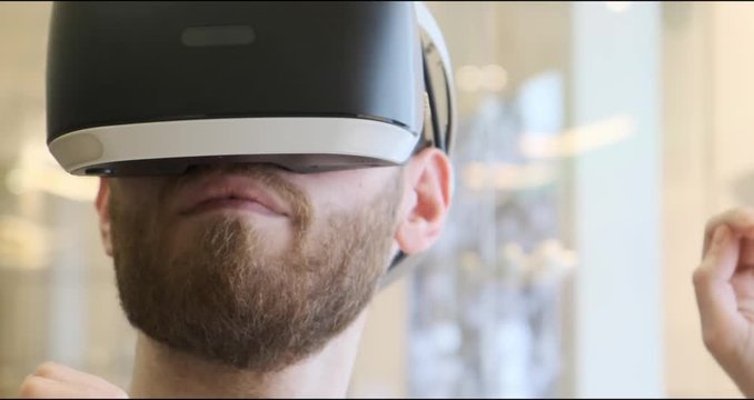 Man using virtual reality headset indoors 4k, close-up
