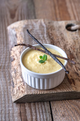 Custard on the wooden background