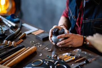young man working with a graving ball at workplace. close up cropped photo, design