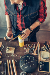 young jeweler checking the gas tool, hand torch, top view