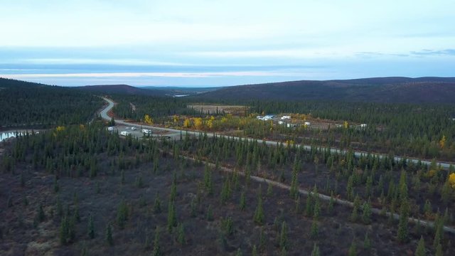 Scenic aerial drone shot of green landscape along the Richardson Highway in Meiers Lake, Alaska